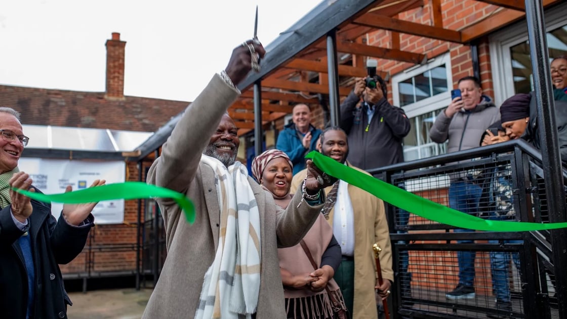 Levi Roots cutting the ribbon to the INI Food and Wellbeing Centre